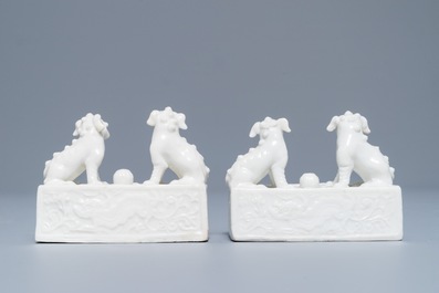 A pair of Chinese Dehua blanc de Chine scroll weights, Kangxi