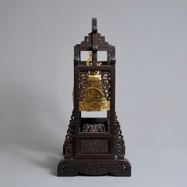 A Chinese gilt bronze bell in zitan suspension frame, Qianlong mark, 18/19th C.