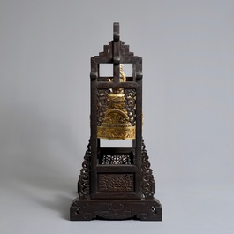 A Chinese gilt bronze bell in zitan suspension frame, Qianlong mark, 18/19th C.