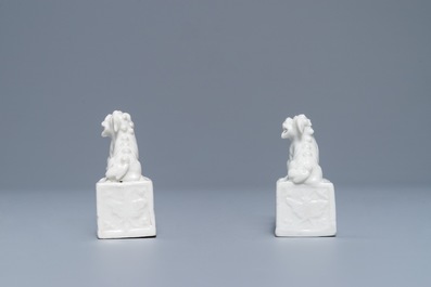 A pair of Chinese Dehua blanc de Chine scroll weights, Kangxi