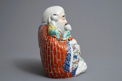 A Chinese famille rose figure of Buddha, 19/20th C.