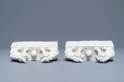 A pair of Chinese Dehua blanc de Chine scroll weights, Kangxi