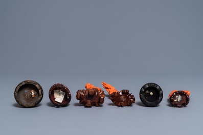 Six Chinese carved coral figures on wooden stands, 19/20th C.
