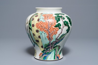 A Chinese famille verte vase with figures in a temple, Kangxi mark, 19th C.