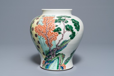 A Chinese famille verte vase with figures in a temple, Kangxi mark, 19th C.