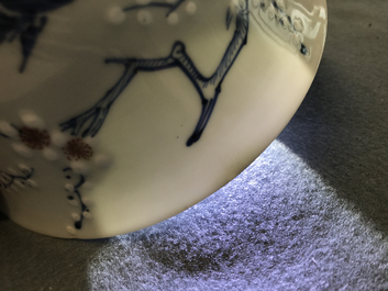 A Chinese blue, white and red on celadon ground 'prunus' bowl, Kangxi