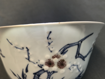 A Chinese blue, white and red on celadon ground 'prunus' bowl, Kangxi