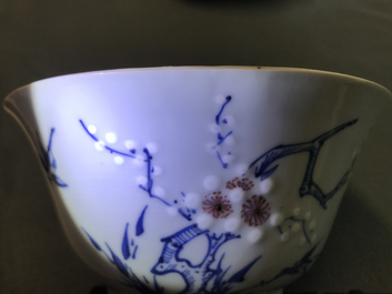 A Chinese blue, white and red on celadon ground 'prunus' bowl, Kangxi
