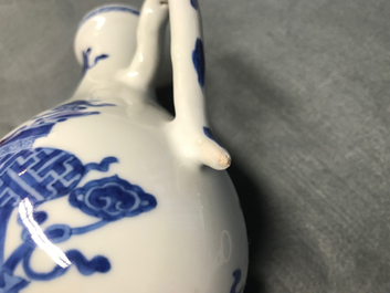 A Chinese blue and white ewer and cover with 'antiquities' design, Kangxi