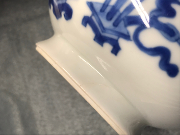 A Chinese blue and white ewer and cover with 'antiquities' design, Kangxi