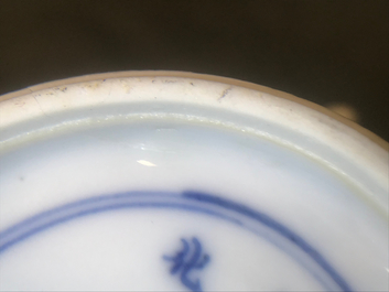 A Chinese blue and white ewer and cover with 'antiquities' design, Kangxi