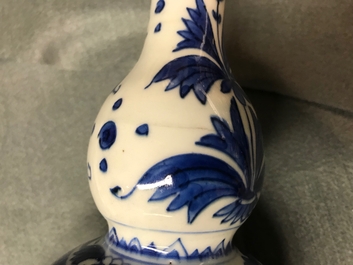 A Chinese blue and white double gourd vase with figures in a landscape, Transitional period