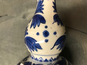 A Chinese blue and white double gourd vase with figures in a landscape, Transitional period