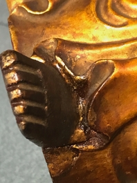 A Chinese carved gilt wood figure of Buddha standing, 18/19th C.
