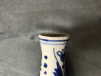 A Chinese blue and white double gourd vase with figures in a landscape, Transitional period