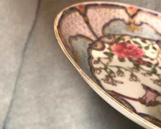 A fine Chinese famille rose saucer plate with armorial and floral design, Yongzheng