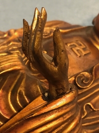A Chinese carved gilt wood figure of Buddha standing, 18/19th C.