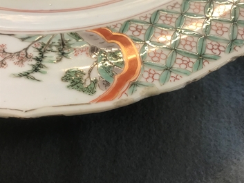 A Chinese famille verte dish with ladies in a garden, Kangxi