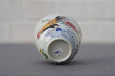 A Chinese famille rose cup and saucer with roosters, Yongzheng
