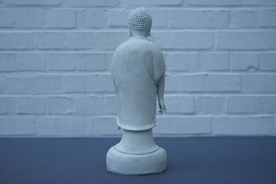 A Chinese Dehua blanc de Chine model of a standing Buddha, impressed mark on the back, Kangxi