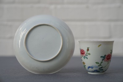 A Chinese famille rose cup and saucer with roosters, Yongzheng