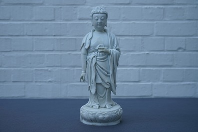 A Chinese Dehua blanc de Chine model of a standing Buddha, impressed mark on the back, Kangxi