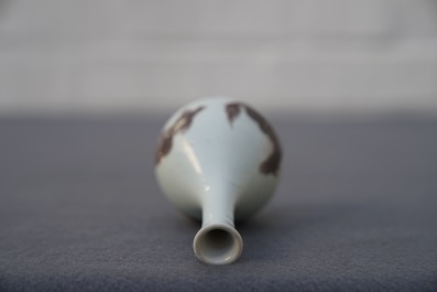 A Chinese copper-red bottle vase with mythical creatures, Kangxi