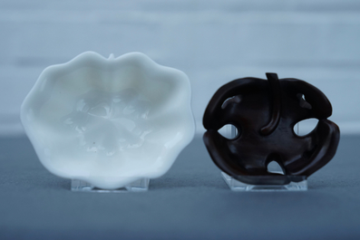A Chinese Dehua blanc de Chine lotus leaf-shaped brush washer on stand, Kangxi