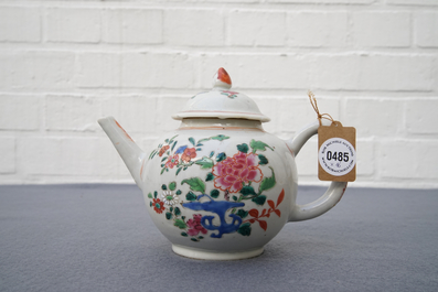 A Chinese famille rose teapot, nine cups and six saucers, Qianlong