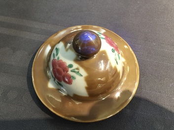 A Chinese capucin ground famille rose five-piece garniture with floral design, Qianlong