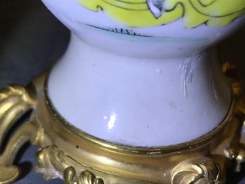 Une paire de vases en porcelaine de Chine famille rose mont&eacute;s comme candelabres, Yongzheng