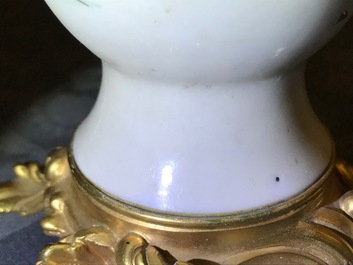 Une paire de vases en porcelaine de Chine famille rose mont&eacute;s comme candelabres, Yongzheng