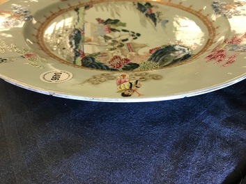 A Chinese famille rose "Eight Immortals" charger with a central landscape, Qianlong
