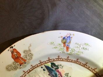 A Chinese famille rose "Eight Immortals" charger with a central landscape, Qianlong