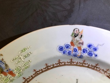 A Chinese famille rose "Eight Immortals" charger with a central landscape, Qianlong