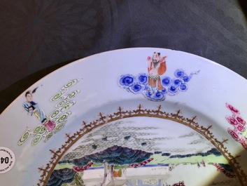 A Chinese famille rose "Eight Immortals" charger with a central landscape, Qianlong