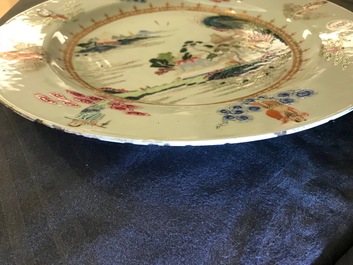 A Chinese famille rose "Eight Immortals" charger with a central landscape, Qianlong
