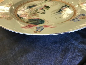 A Chinese famille rose "Eight Immortals" charger with a central landscape, Qianlong