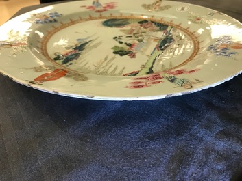 A Chinese famille rose "Eight Immortals" charger with a central landscape, Qianlong