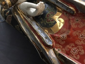 A large Japanese Satsuma figure of Kannon on laquered wooden stand, Meiji, 19/20th C.