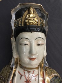A large Japanese Satsuma figure of Kannon on laquered wooden stand, Meiji, 19/20th C.