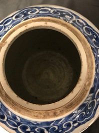 A pair of Chinese blue and white jars and wooden covers, 18/19th C.