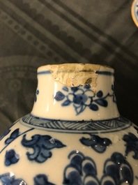 A Chinese blue and white four-piece garniture with floral design, Kangxi