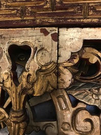 A rare Chinese gilt wood and reverse glass painted mirror, 2nd half 18th C.