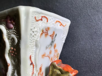 Three Chinese famille rose 'mandarin' vases and covers, Qianlong
