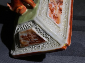 Three Chinese famille rose 'mandarin' vases and covers, Qianlong