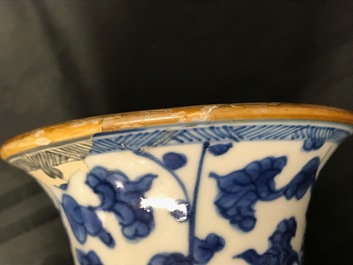 A Chinese blue and white four-piece garniture with floral design, Kangxi