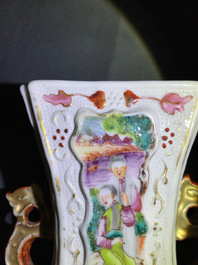Three Chinese famille rose 'mandarin' vases and covers, Qianlong