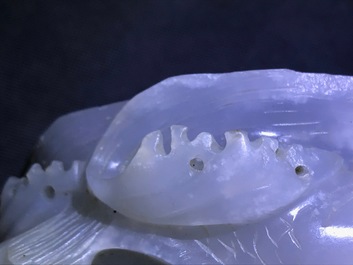 A Chinese white jade group with boys on a raft on carved wooden base, Qing