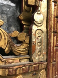 A rare Chinese gilt wood and reverse glass painted mirror, 2nd half 18th C.